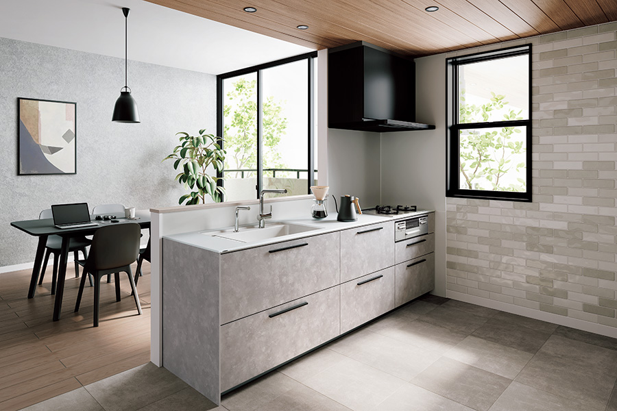 TOTOのシステムキッチン「クラッソ」の施工イメージ。グレー基調の対面キッチンで、すっきりしたデザインとお手入れ性を両立したキッチンリフォーム