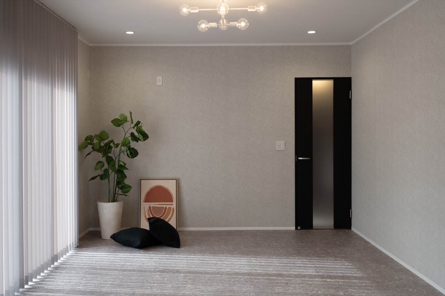 リノベーション後のグレー基調で落ち着いたリビング空間